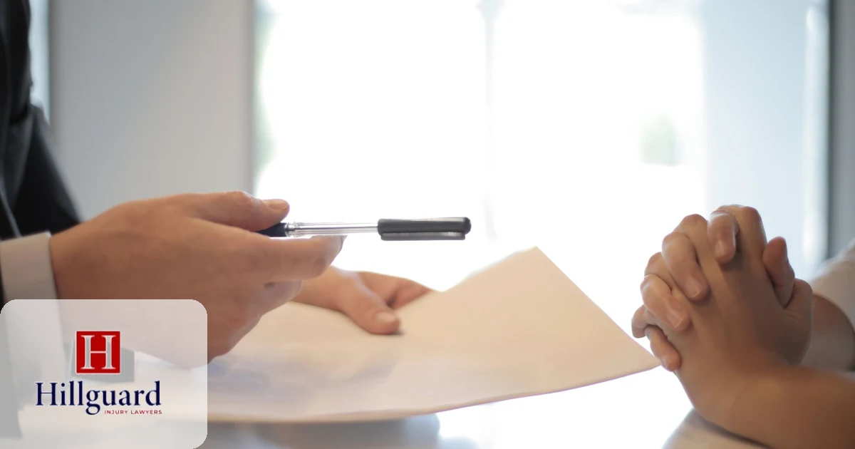 Client signing a dog bite injury settlement agreement with their attorney