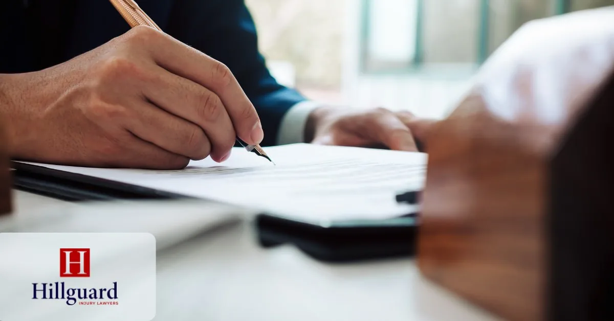 Client signing a California personal injury contingency fee agreement with a fountain pen