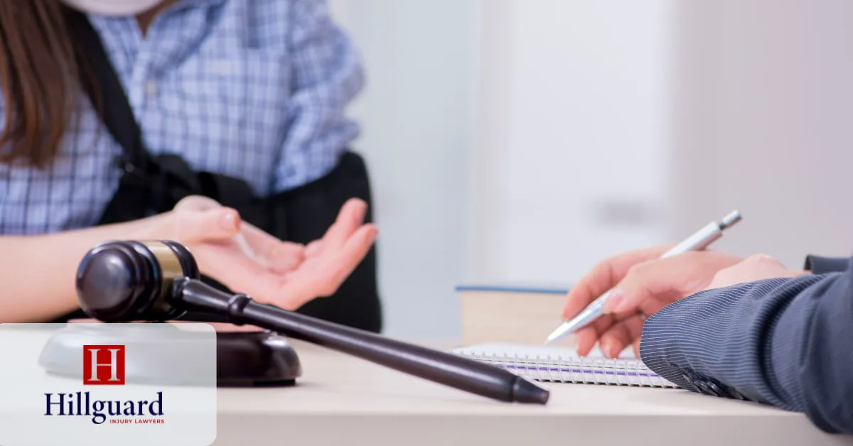 Injured client in an arm sling consulting a California personal injury attorney