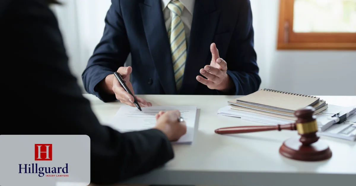Personal injury lawyer reviewing settlement documents with a client