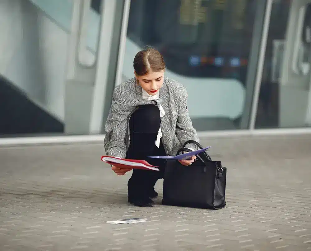 Woman With Suitcase Standing By Airport