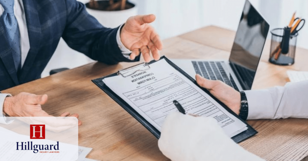 Client reviewing and signing a personal injury claim form with a California injury lawyer.